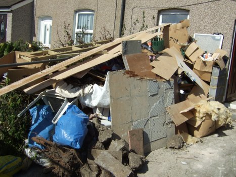 Garden debris being removed by professionals